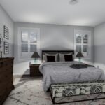 Plan 288-0263 primary bedroom with large windows and decorative accents