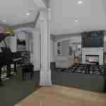 Plan 288-0136 interior view with piano, fireplace, and open layout