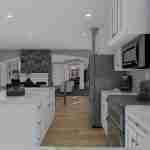 Plan 288-0136 kitchen with island, stone fireplace, and open layout