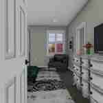 Plan 288-0136 interior view of a cozy bedroom with a dresser and chair