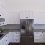 Plan 288-0237 kitchen with white cabinetry and stainless steel appliances