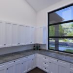 Plan 288-0237 kitchen with large window and white cabinetry