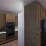 Plan 288-0266 kitchen with dark cabinetry and built-in appliances