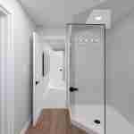 Plan 288-0266 Interior view of a bathroom with glass shower enclosure