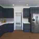 Plan 288-0099 kitchen with dark cabinetry and stainless steel appliances