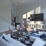 Plan 288-0270 interior view of a living room with high ceilings and stairs