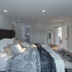 Plan 288-0270 primary bedroom with large bed and modern decor