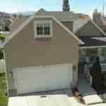 Plan 288-0118 Front view with porch, gable roof, and attached garage