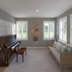 Plan 288-0240 interior view of a cozy living room with piano and windows