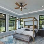 Plan 288-0242 primary bedroom with large windows and a canopy bed