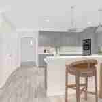 Plan 288-0110 kitchen with island, gray cabinetry, and pendant lighting