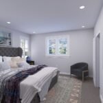 Plan 288-0223 primary bedroom with large windows and cozy decor