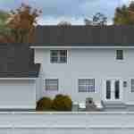 Plan 288-0129 Rear view of a two-story home with a patio area