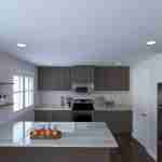 Plan 288-0129 kitchen with island, gray cabinets, and stainless appliances