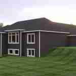 Plan 580-1352 Rear view of a modern home with a sloped roof