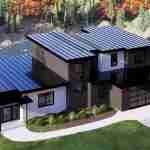 Plan 580-1362 Angled front view of a modern home with a flat roof